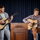 Image for article titled Nation’s Men Holding Acoustic Guitars Announce Plan To Idly Strum While You Try To Talk To Them